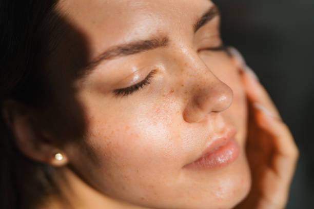 Close-up portrait of a beautiful young woman, who is not wearing any make up